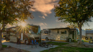 Sunburst above the motorhome camping in the morning at a campsite