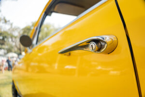 Detail of a door handle of an old classic car.